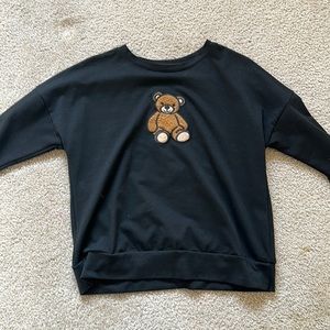 Women’s black teddy bear patch long sleeve shirt.